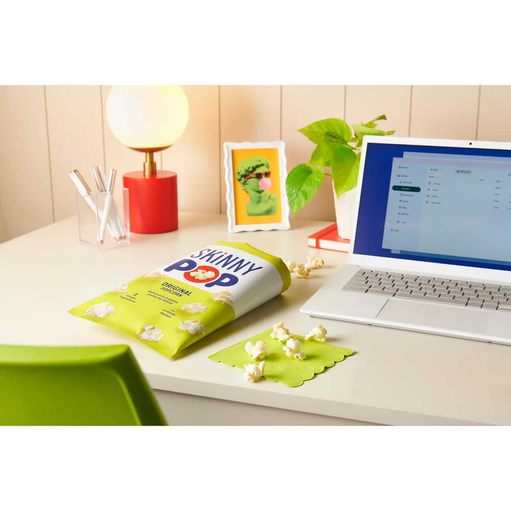 Twelve-pack SkinnyPop Original box packaging for convenient sharing and stocking.