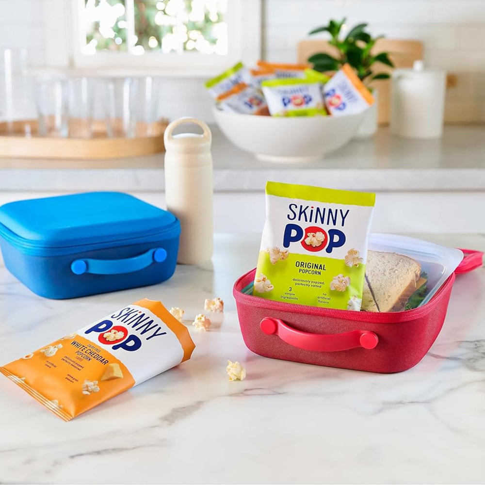 SkinnyPop Original Dairy Free White Cheddar bag open for quick snacking