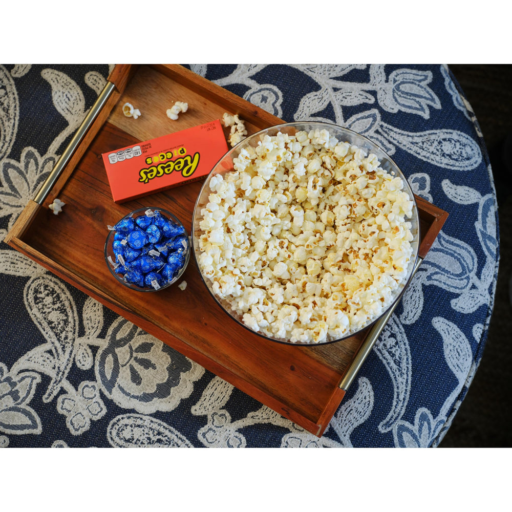 SkinnyPop pantry spread featuring roasted garlic butter popcorn on display.