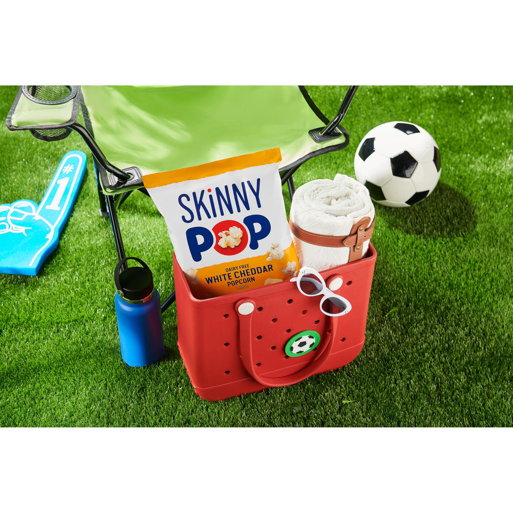 SkinnyPop White Cheddar popcorn kernels closeup highlights crispy, airy texture for snacking
