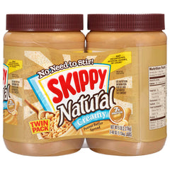 SKIPPY Natural Creamy Peanut Butter twin-pack jars on the counter for quick, smooth spreading.