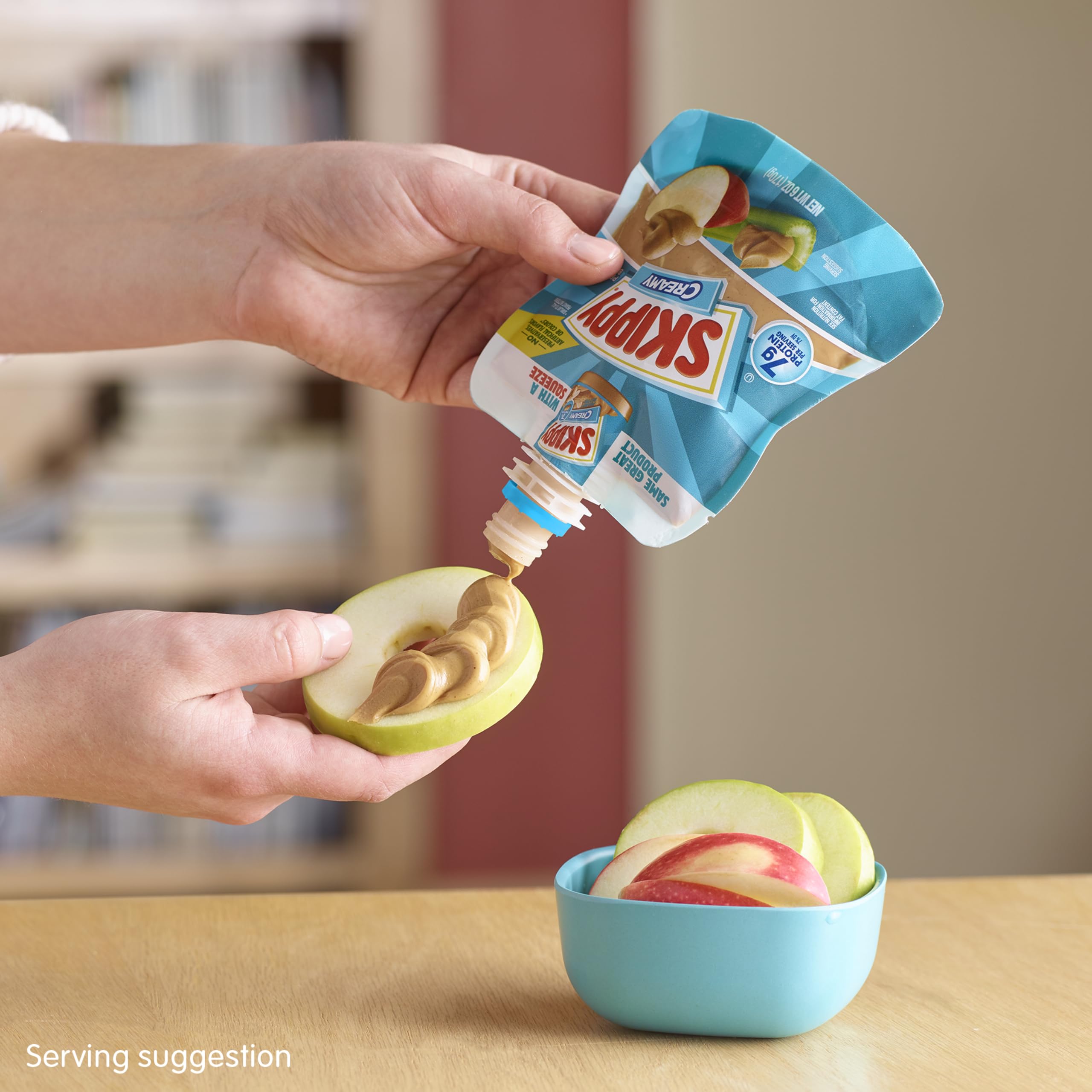 SKIPPY Squeeze creamy peanut butter on a cracker