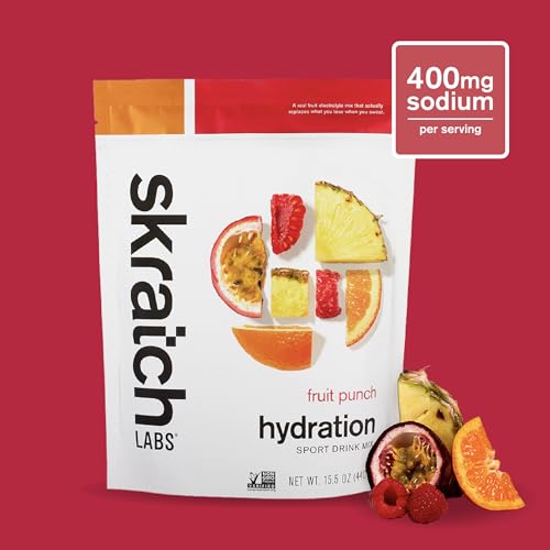 Pouring Skratch Labs Hydration Fruit Punch powder into water for fast hydration