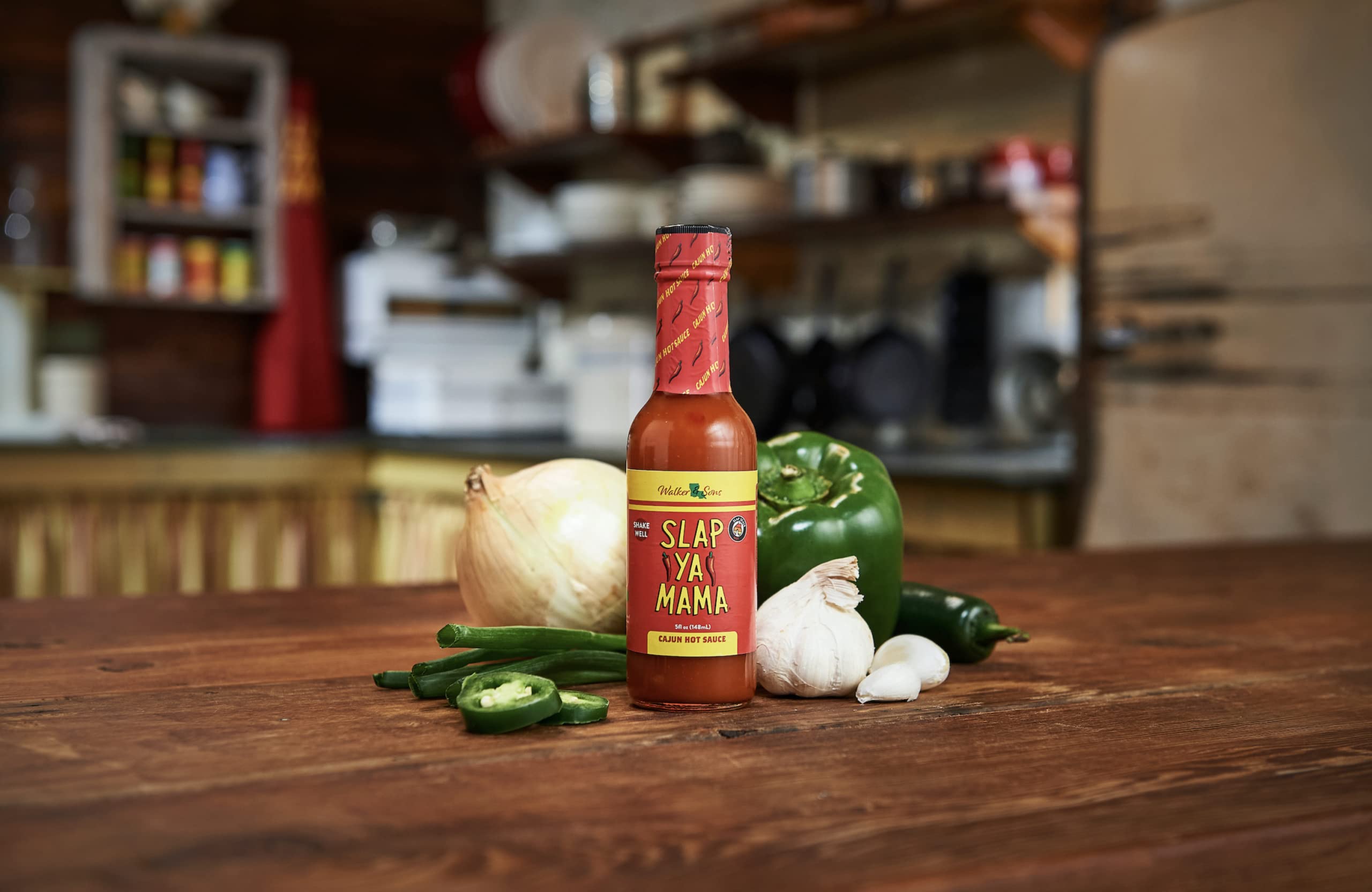 Slap Ya Mama bottle with secure cap for tidy kitchen use.
