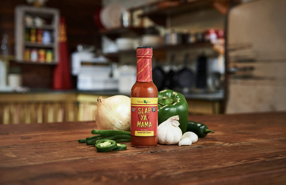 Slap Ya Mama bottle with secure cap for tidy kitchen use.