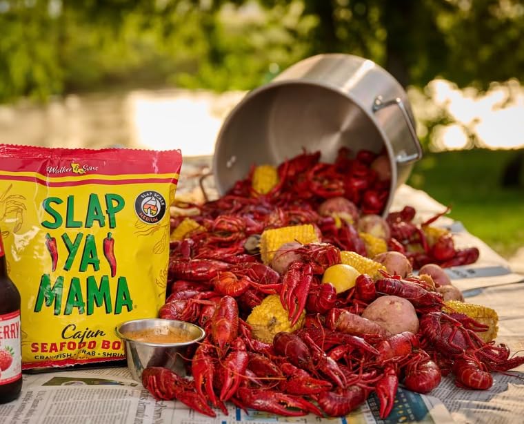 Family kitchen scene featuring Slap Ya Mama seasoning on the counter.