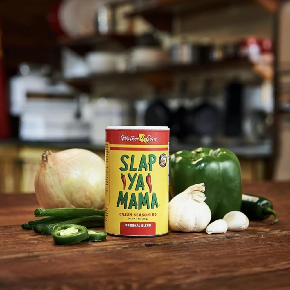 Slap Ya Mama Original Blend Cajun Seasoning being poured into skillet for vibrant flavor
