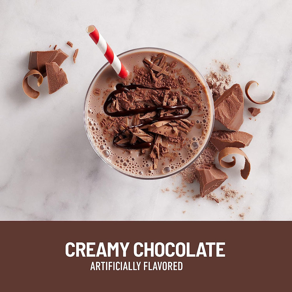 Pouring SlimFast chocolate shake into a glass for a smooth serving.