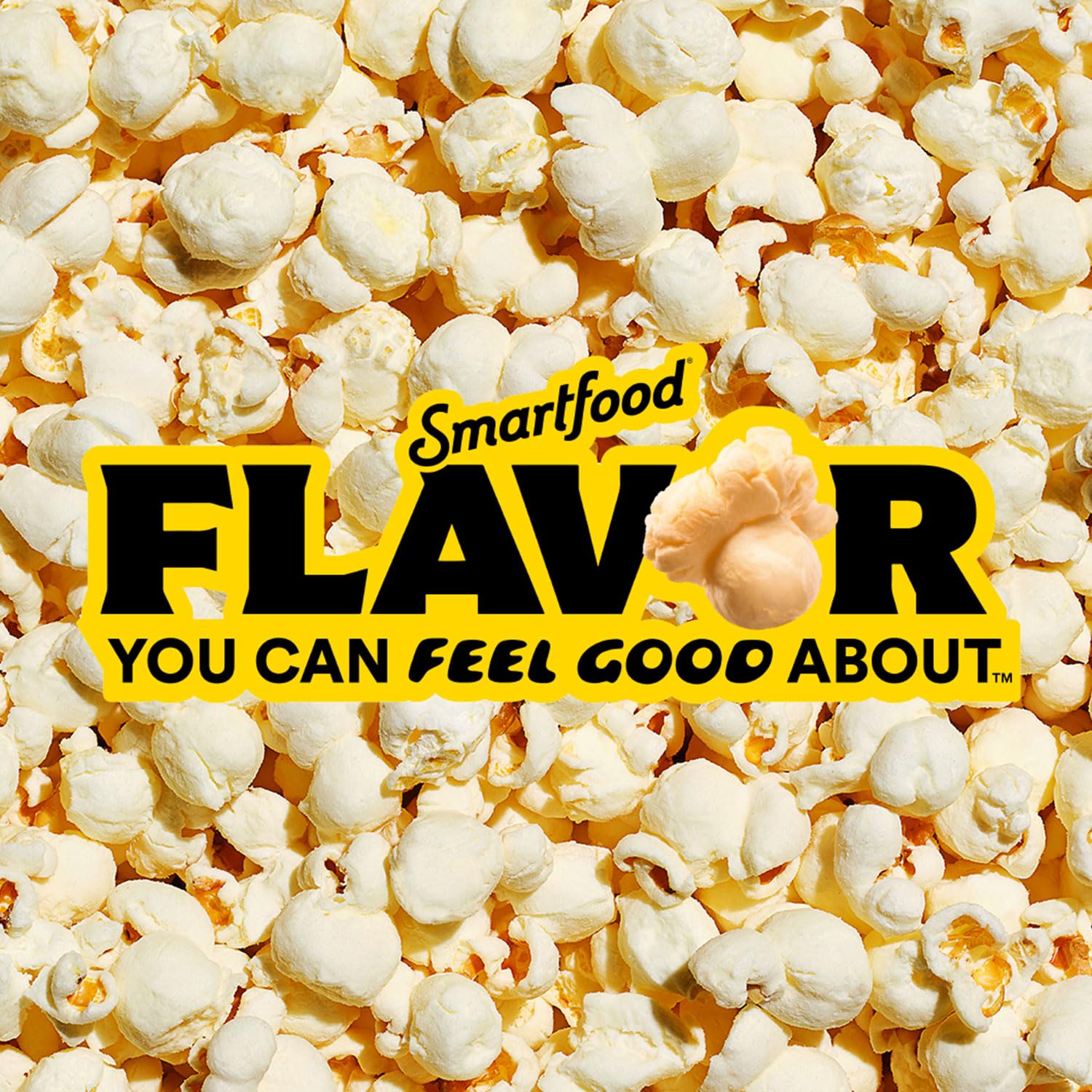 Smartfood White Cheddar popcorn close-up reveals cheddar flavor crystals.