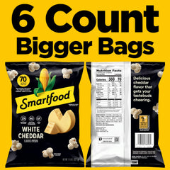 Close-up of Smartfood White Cheddar kernels with cheese coating