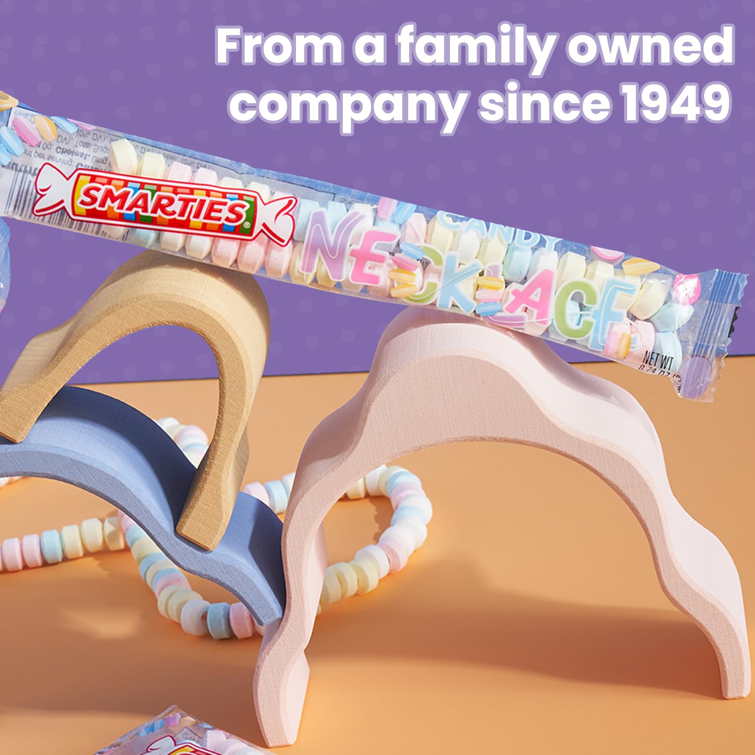 Smarties candy necklace with individually wrapped pieces for hygienic sharing.