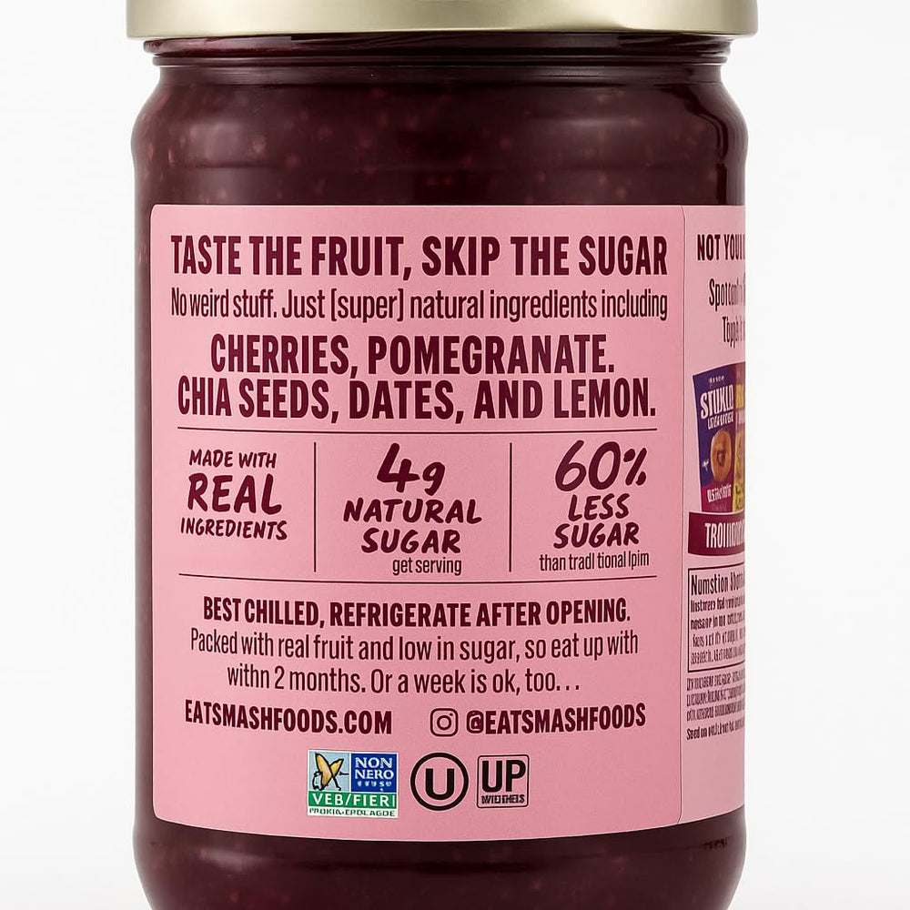 Smash Foods Cherry Pomegranate Spread on spoon, a flavorful snack with natural sweetness.