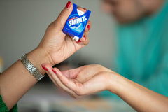 Smint dental mint bottle top view emphasizing xylitol content.