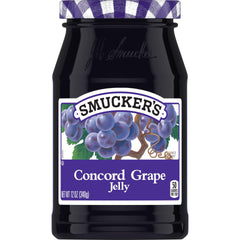 Smucker's Concord Grape Jelly jar ready to spread on toast, a timeless breakfast staple.