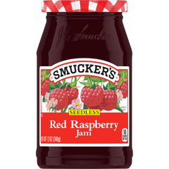 Smucker's seedless raspberry jam jar with bright spread on toast