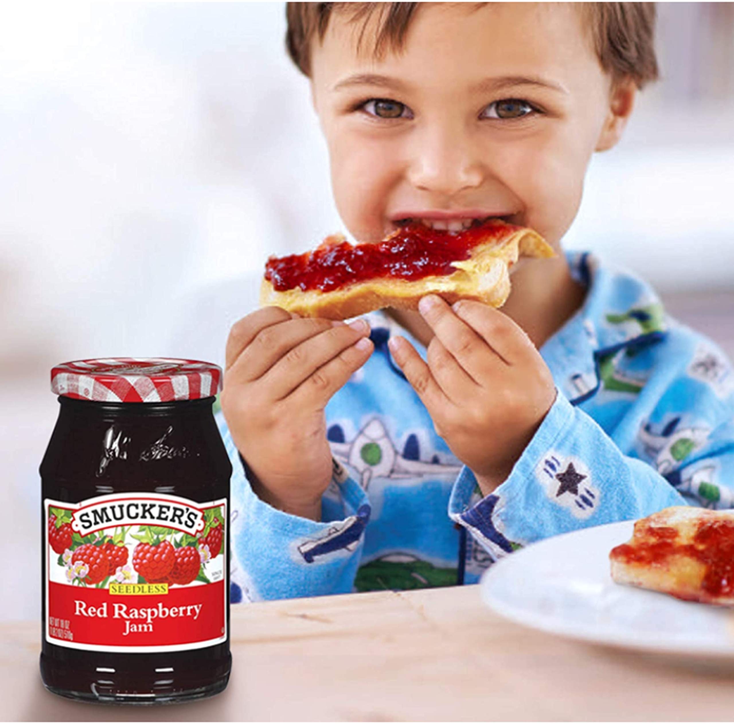 Smucker's seedless raspberry jam spread on toast, breakfast-ready