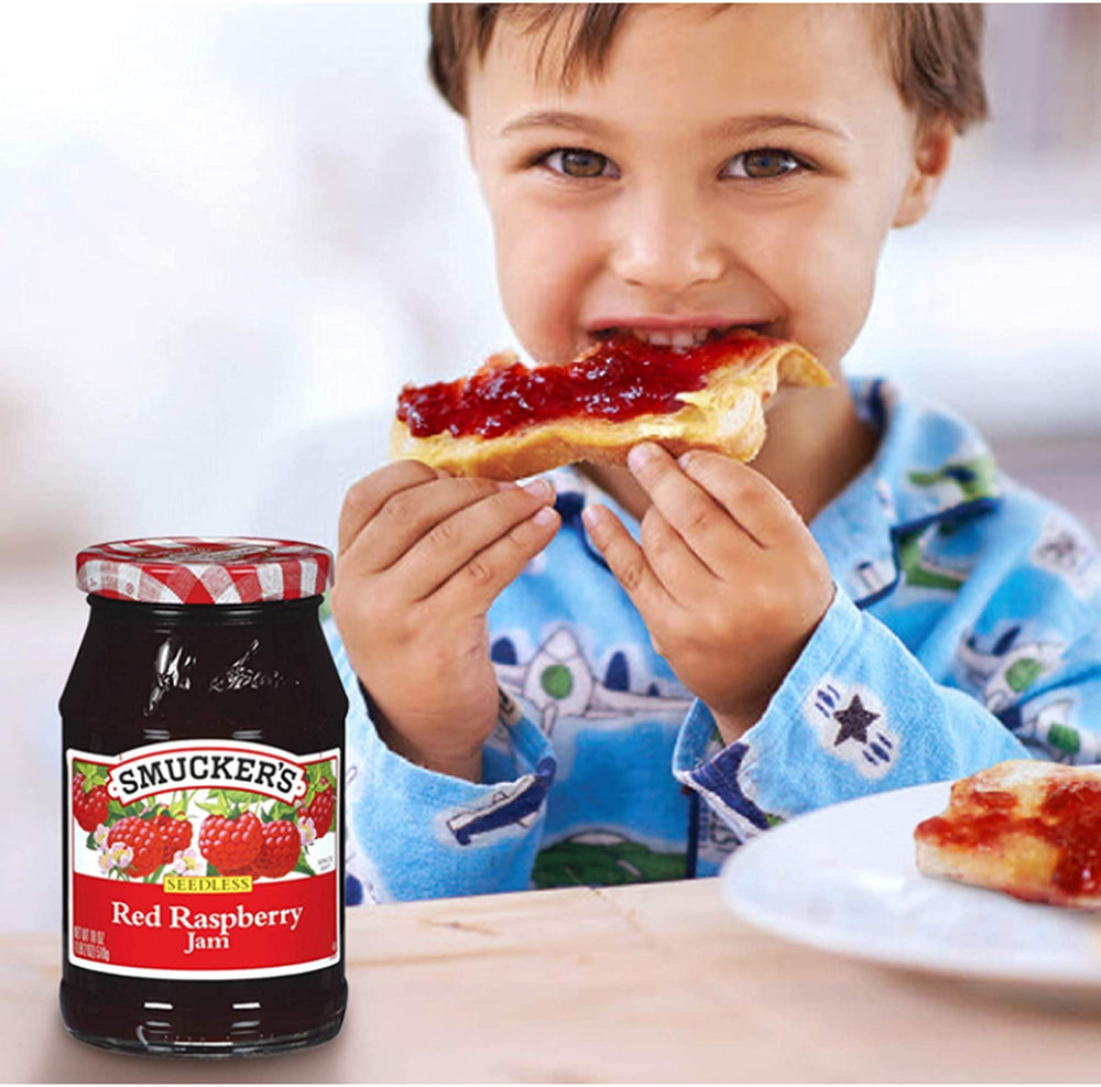 Smucker's seedless raspberry jam spread on toast, breakfast-ready