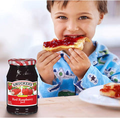 Smucker's seedless raspberry jam spread on toast, breakfast-ready