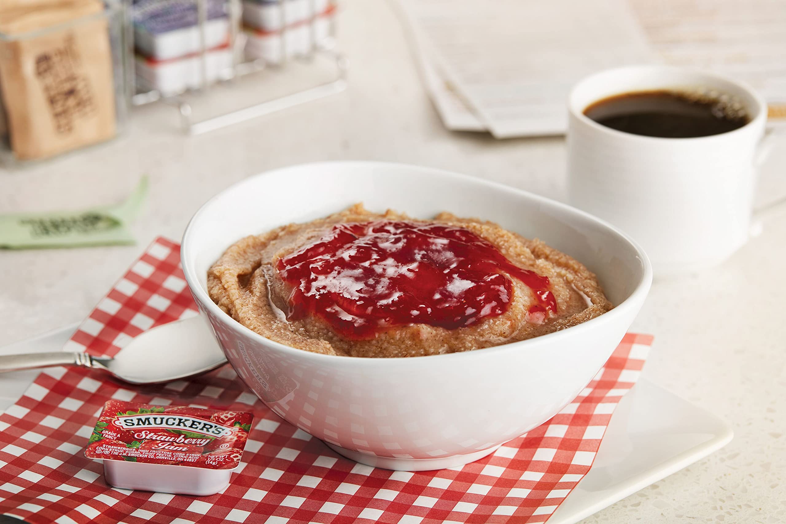 Smucker's strawberry jam packaging showcases freshness and attractive table presence.