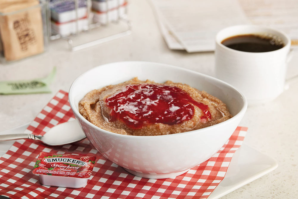 Smucker's strawberry jam packaging showcases freshness and attractive table presence.