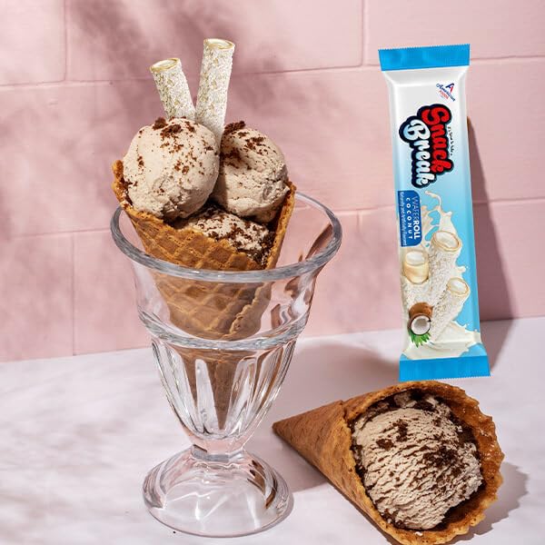 Snack Break coconut wafer rolls with tea suggests a delightful afternoon pairing.