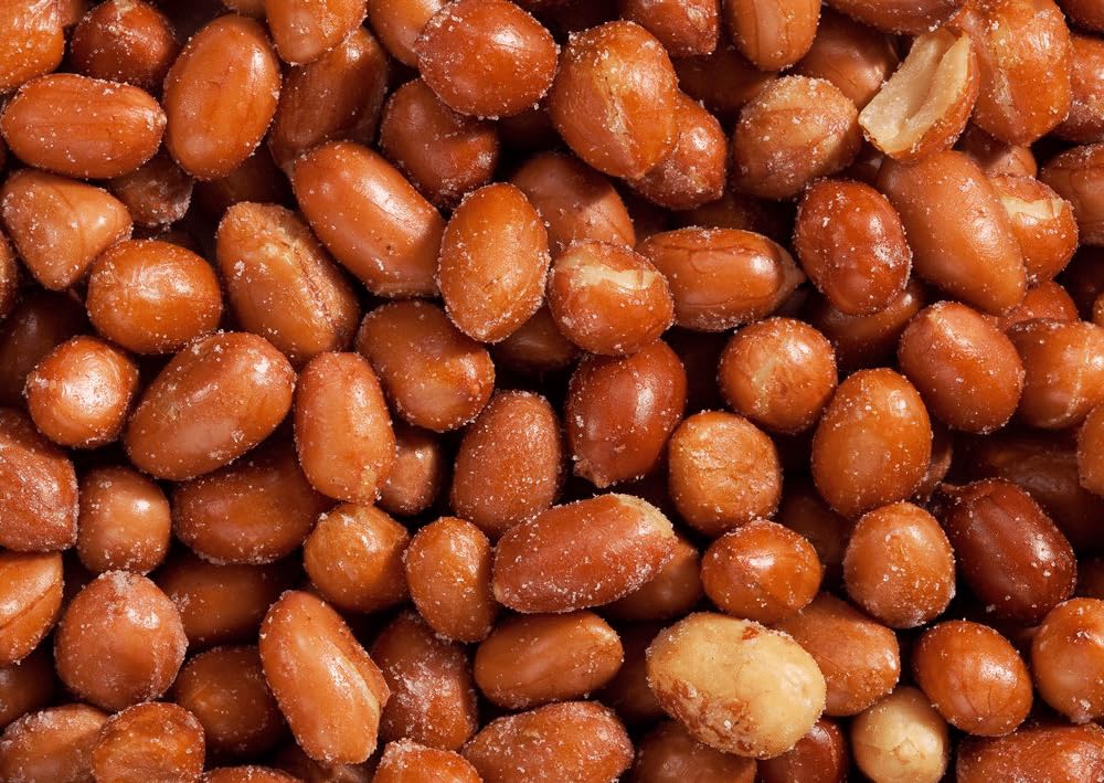 Snack Delight roasted Spanish peanuts red skin pack closeup highlights premium crunch for on-the-go snacking.