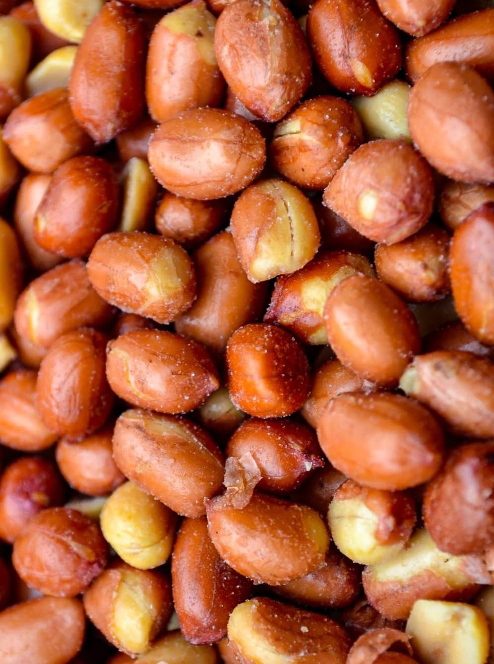 Snack Delight Spanish peanuts crunch closeup emphasizes texture and flavor for satisfying bites.
