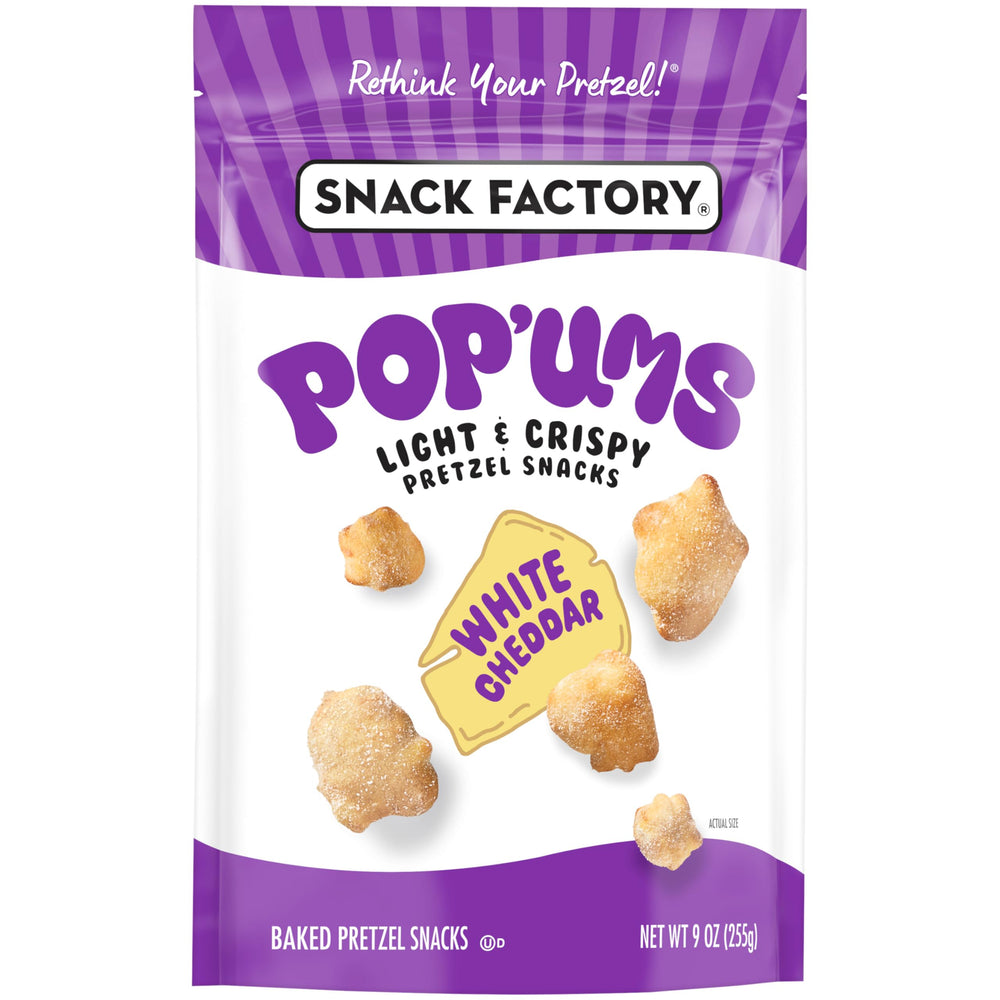 Snack Factory Pop’ums cheddar flakes detail reveals real cheese texture.