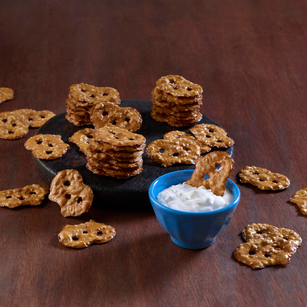 Snack Factory Pretzel Crisps Original served with hummus dip pairing.