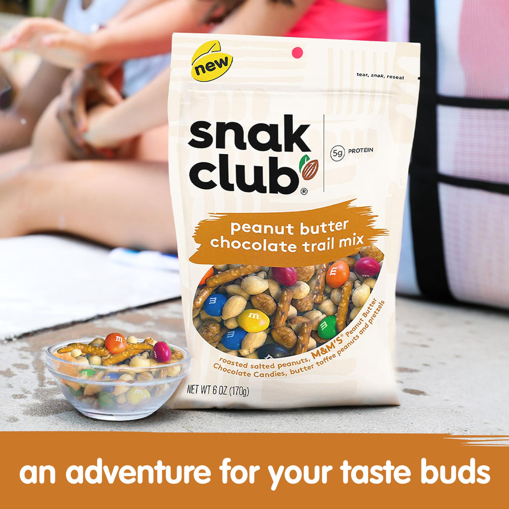 Peanut butter M&M's visible in Snak Club trail mix for creamy candy flavor.
