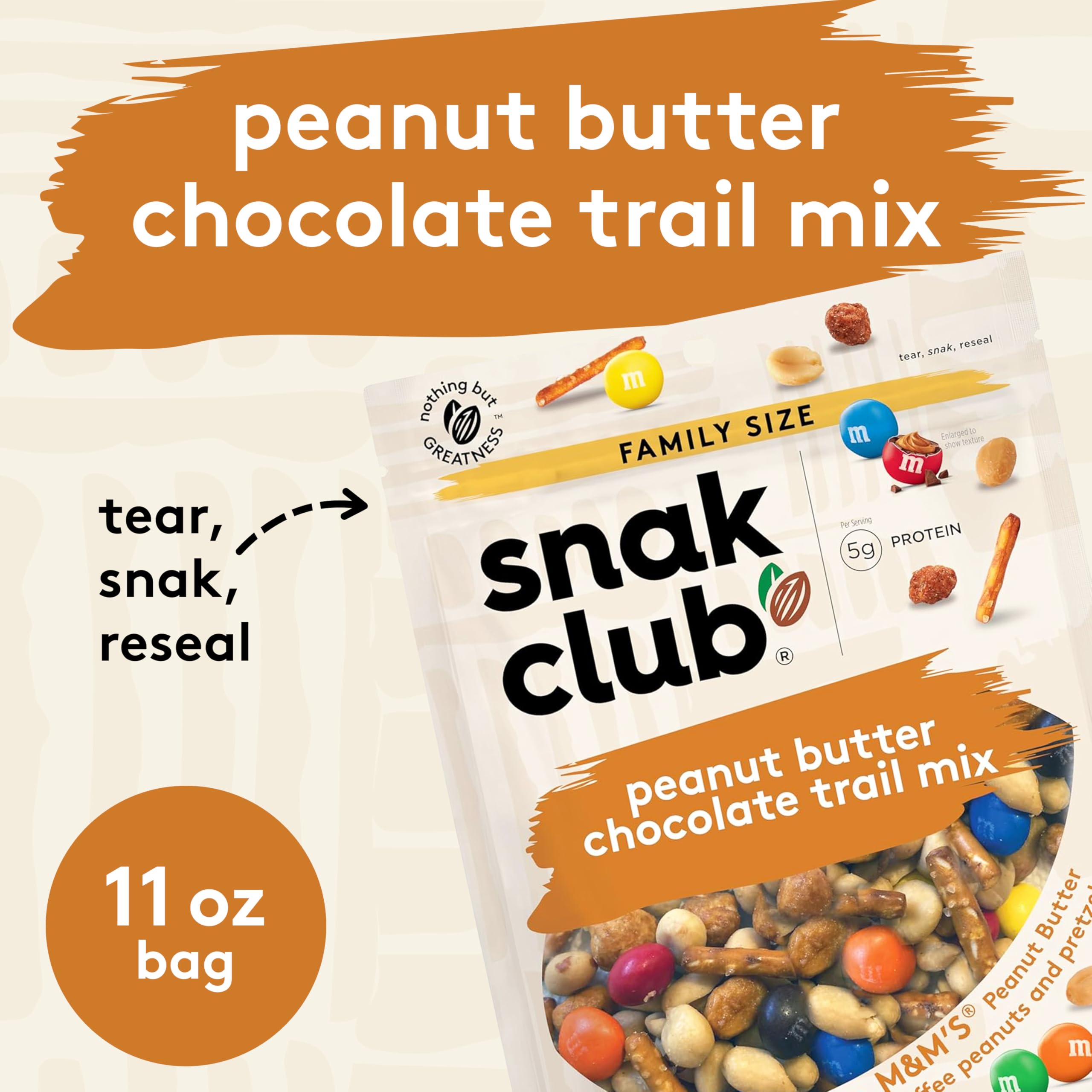 Trail mix being poured from Snak Club bag highlighting texture and variety