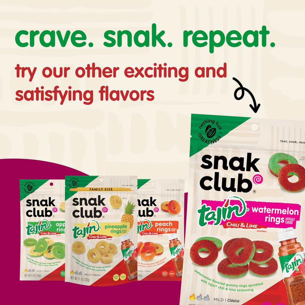 Snak Club Tajin Mango Rings ideal for travel snacks in a backpack.