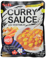 S&B curry sauce with vegetables hot in retort pouch for quick meals.