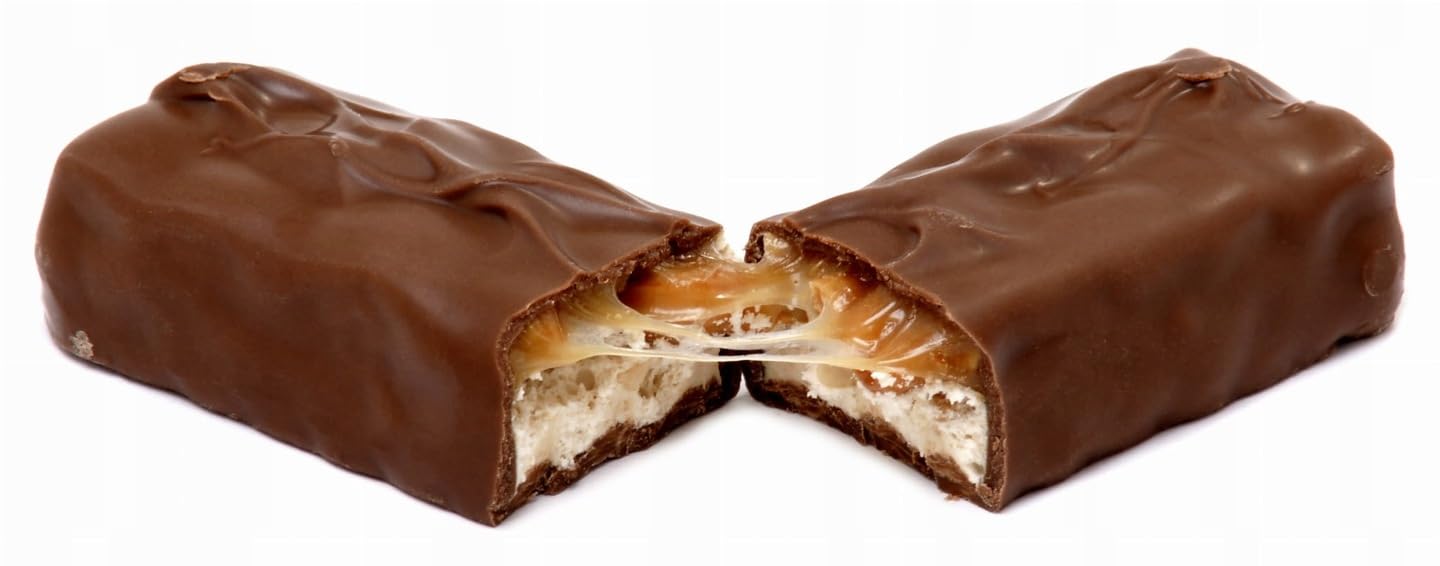 Snickers chocolate bar with peanuts and caramel, ready-to-eat treat after a workout