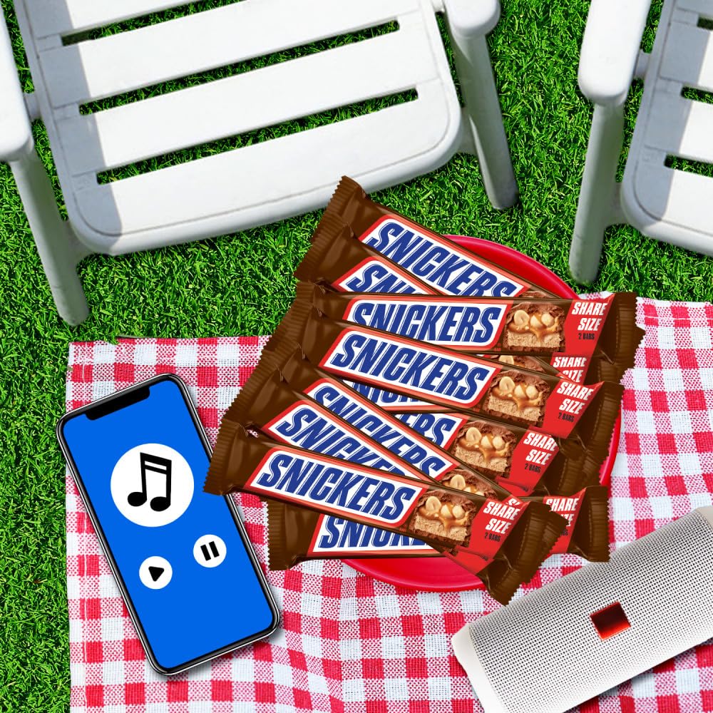 Pantry stocked with Snickers sharing packs for guests.