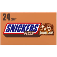 Close-up of Snickers Pecan bar showing pecans, caramel, nougat, and chocolate for on-the-go indulgence