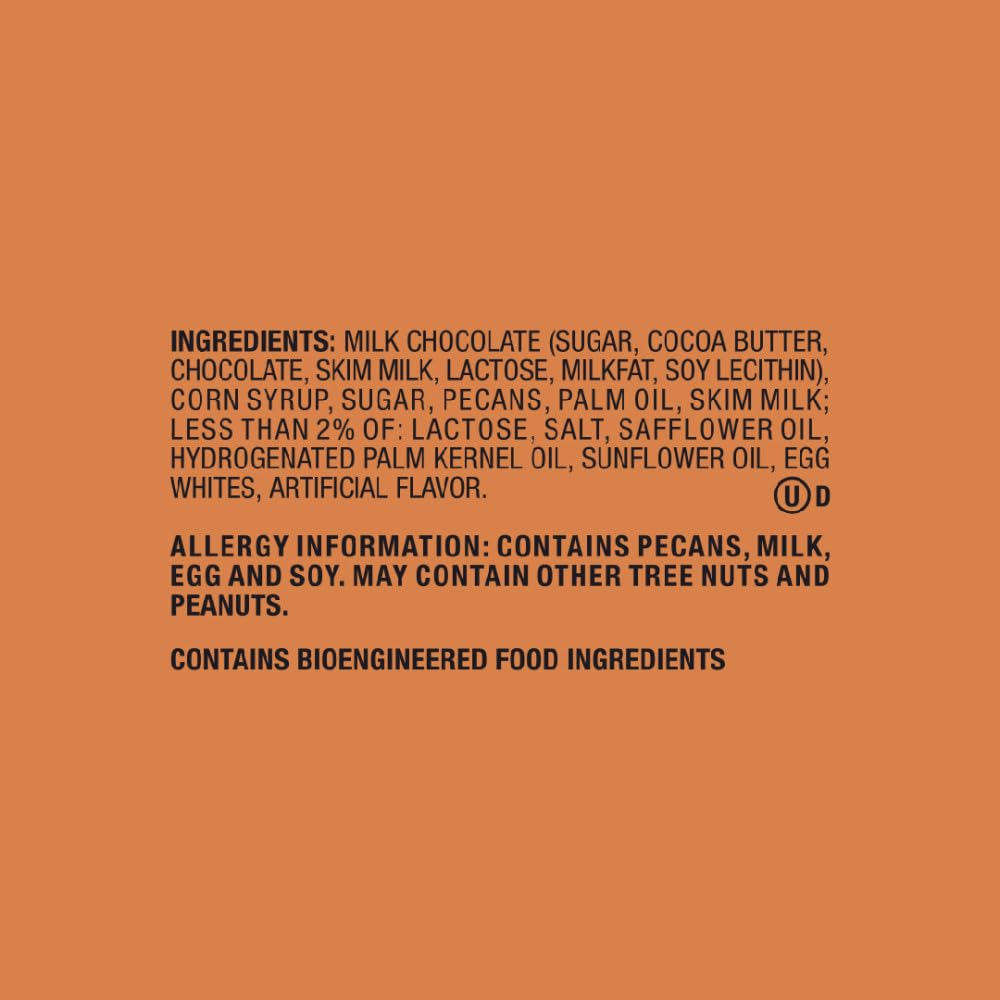 Snickers Pecan Milk Chocolate Bar cross-section shows pecans and caramel.
