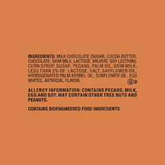 Snickers Pecan Milk Chocolate Bar cross-section shows pecans and caramel.