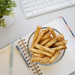 Snyder's of Hanover Honey Wheat Braided Twists on a snack platter, ready for on-the-go.