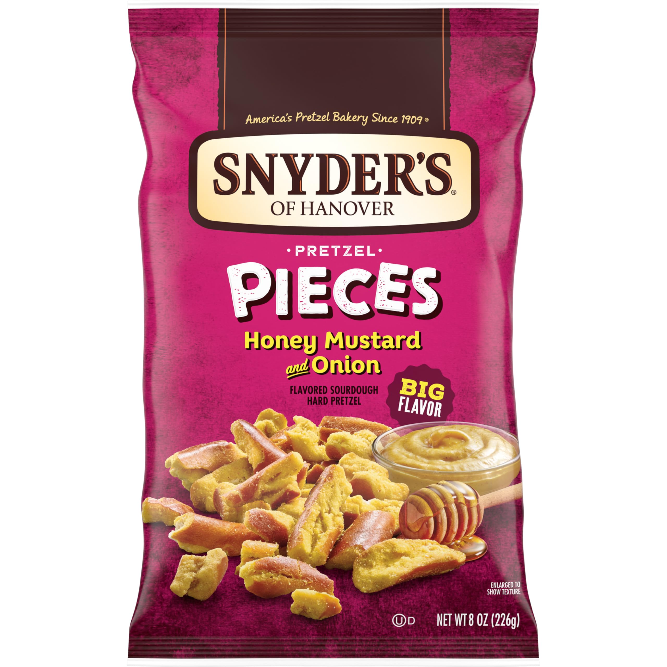 Snyder's of Hanover honey mustard and onion pretzel pieces in the bag, ready for snacking.
