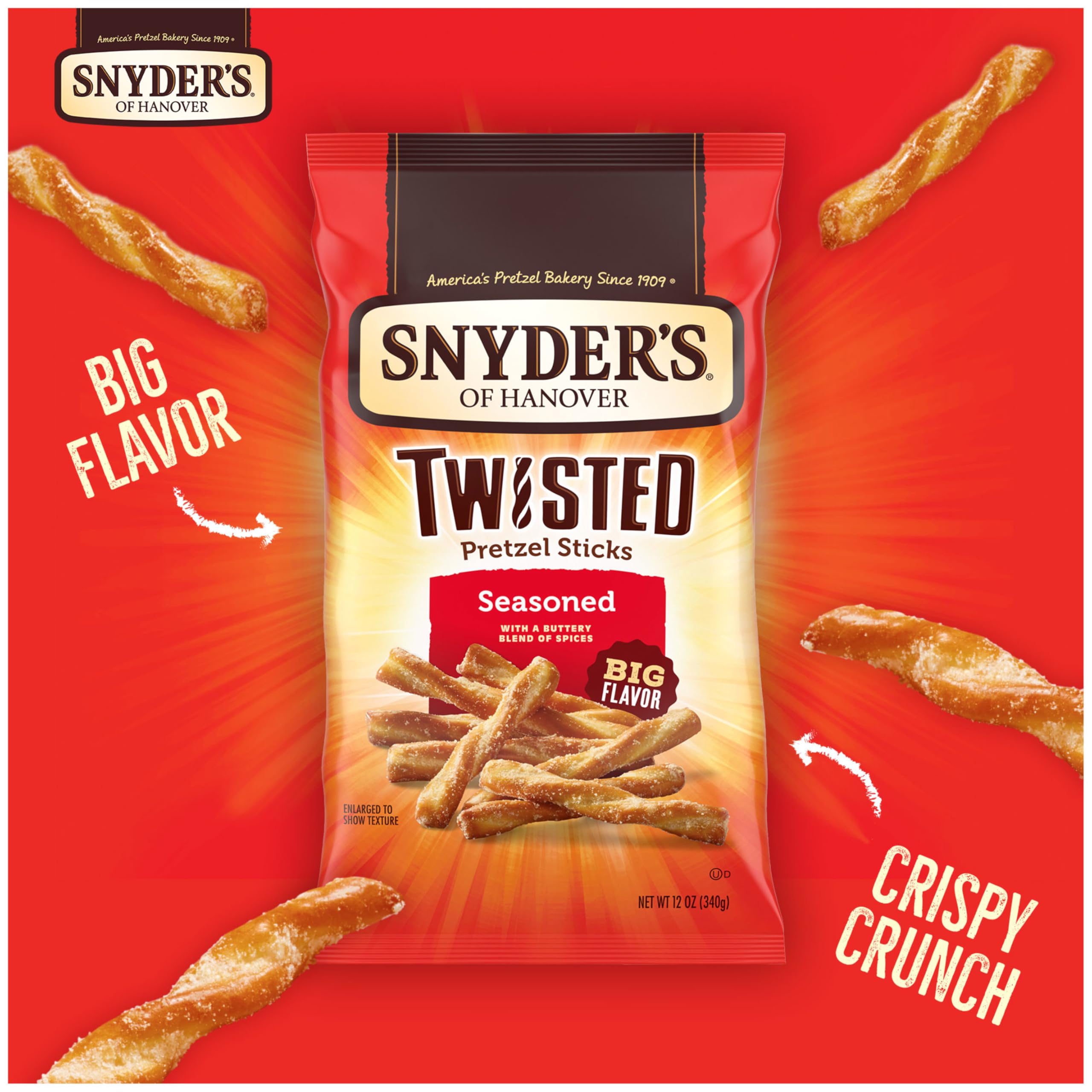 Oven-baked crisp texture highlighted on Snyder's pretzel sticks with bold seasoning.