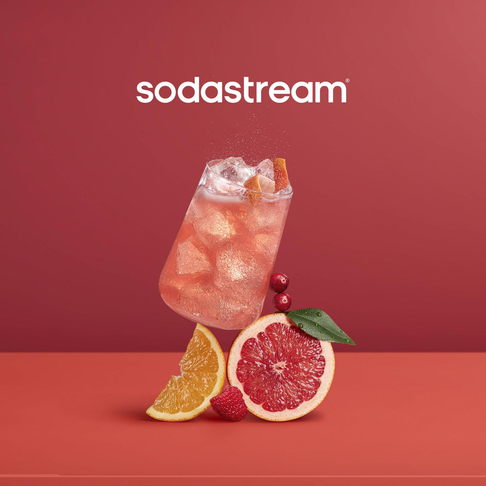 Sodastream Pink Grapefruit Zero Calorie drink pour into glass, showcasing flavorful sparkling water.