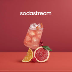 Sodastream Pink Grapefruit Zero Calorie drink pour into glass, showcasing flavorful sparkling water.