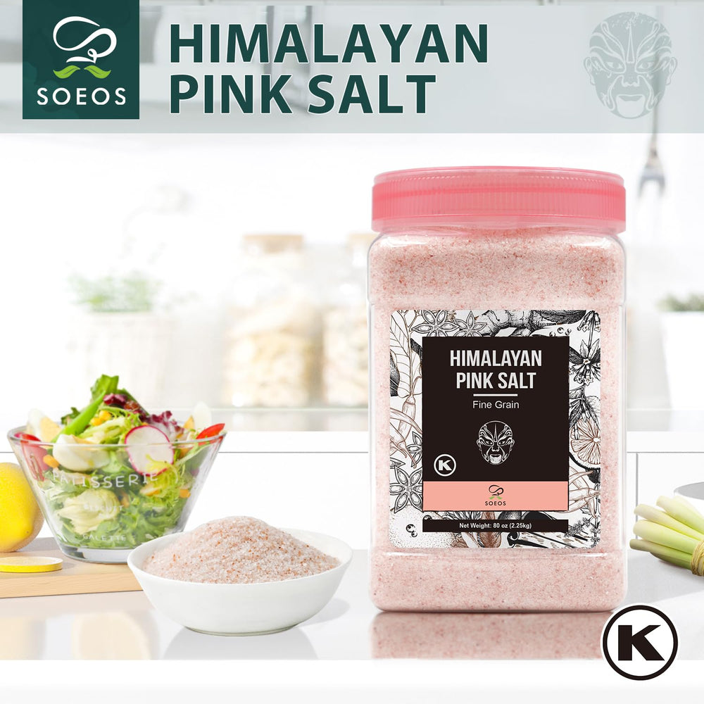 Soeos Himalayan Pink Salt shaker dusting a plate for flavorful finishing.