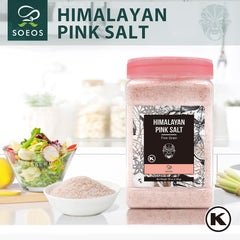 Soeos Himalayan Pink Salt shaker dusting a plate for flavorful finishing.