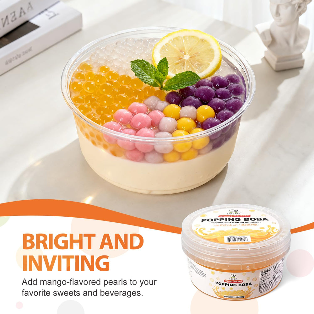 Soeos Mango Popping Boba pearls in smoothie glass with mango hue.