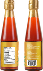 Pouring stream of Soeos sesame oil enhances stir-fry flavor.