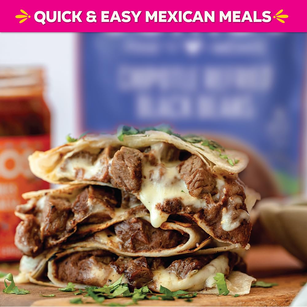 SOMOS Chipotle Refried Beans close-up with rich tomato-spice sauce aroma.