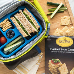Sonoma Creamery Parmesan cheese crisps served with toppings, inviting snacking moment.