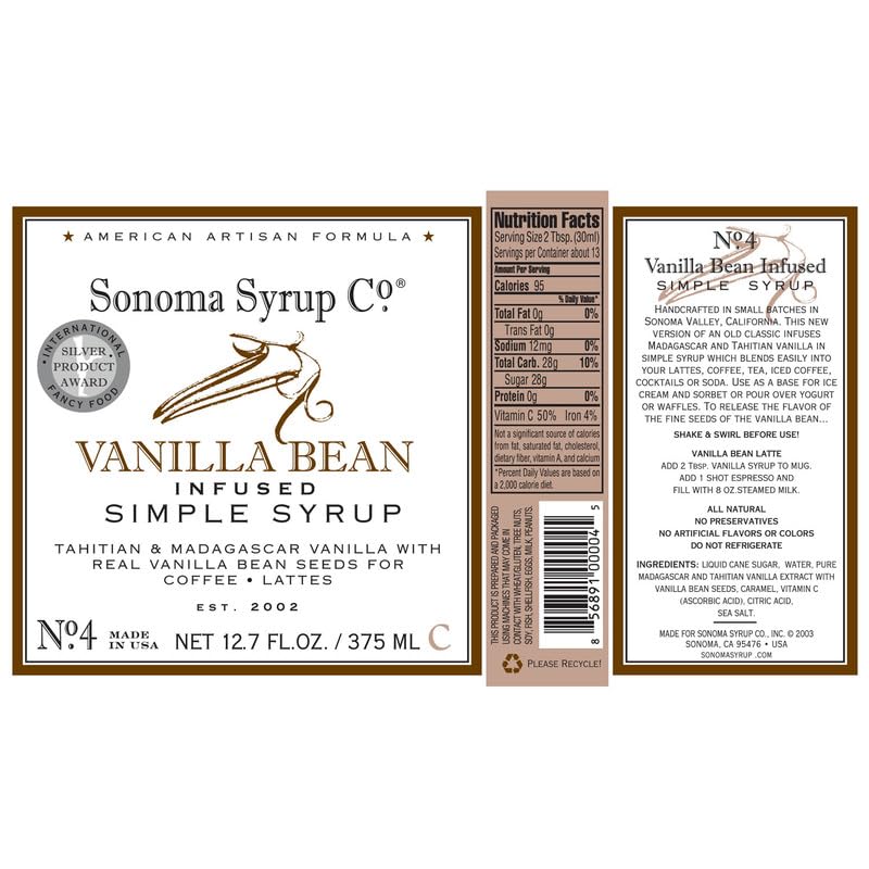 Steam rising as Sonoma Syrup Co. Vanilla Bean Infused Simple Syrup drips into a warm beverage.